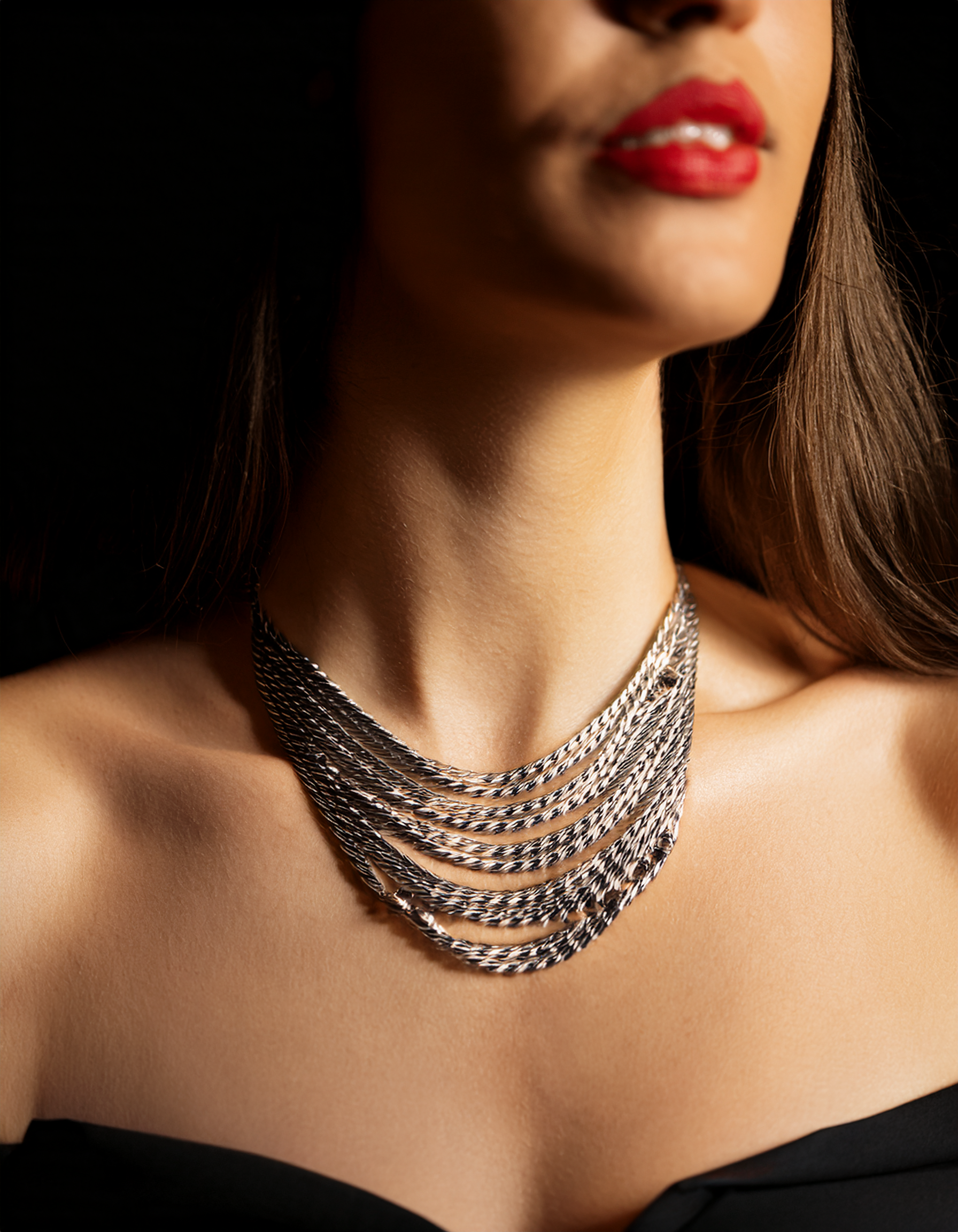 Model wearing Garnet and Peridot Scroll Necklace