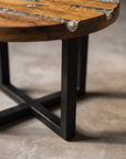 Close-up of the Creeklight Parlor Table matte black steel X-frame base