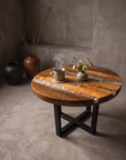Creeklight Parlor Table styled with a steaming mug on a coaster and fresh flowers