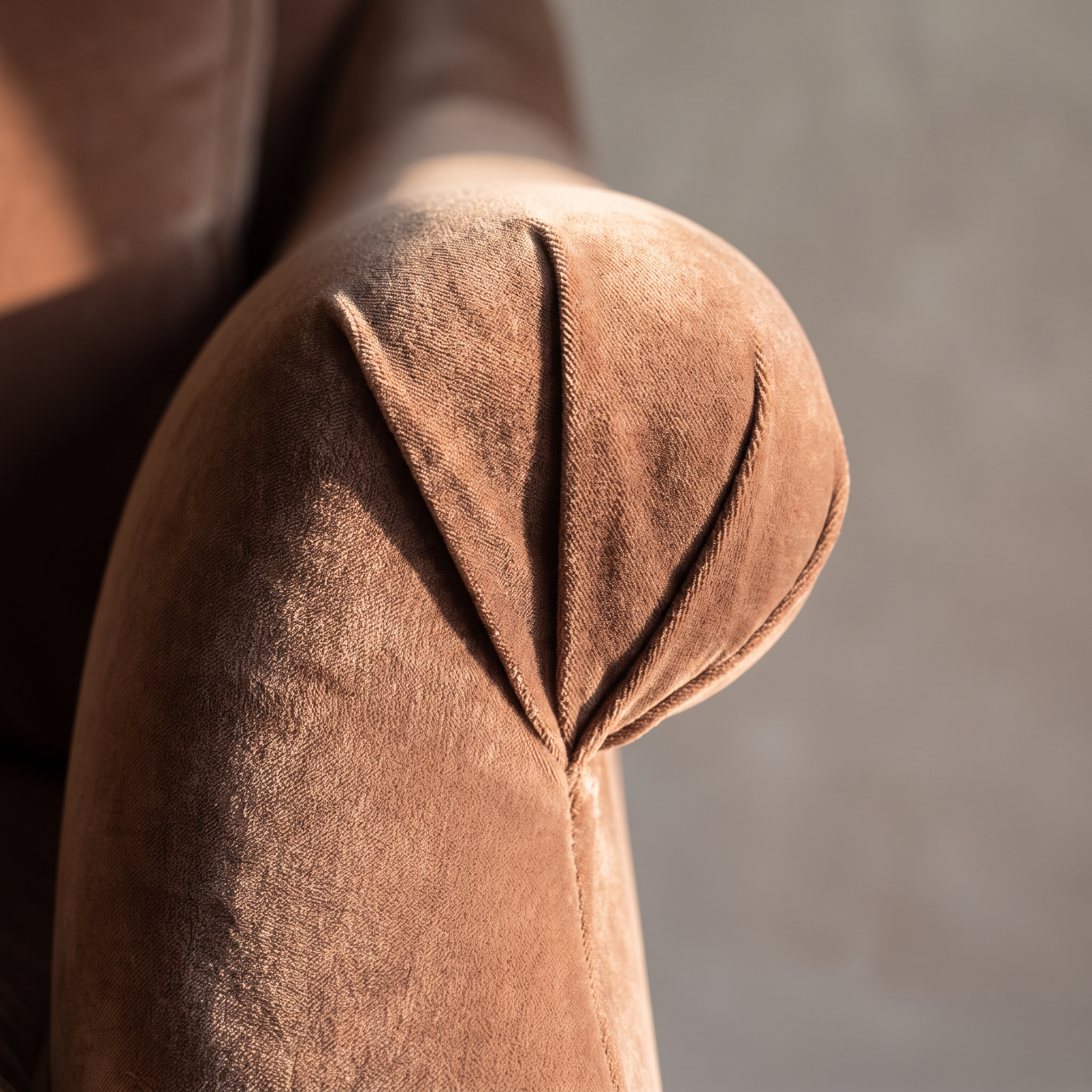 Detail of the rolled arm fan-pleat construction on the Taylor King sofa