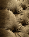 Macro detail of the diamond tufting and olive strie velvet texture