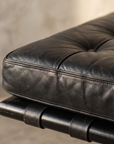 Second detail of the Barcelona Daybed's tufted leather cushion corner and strap stitching