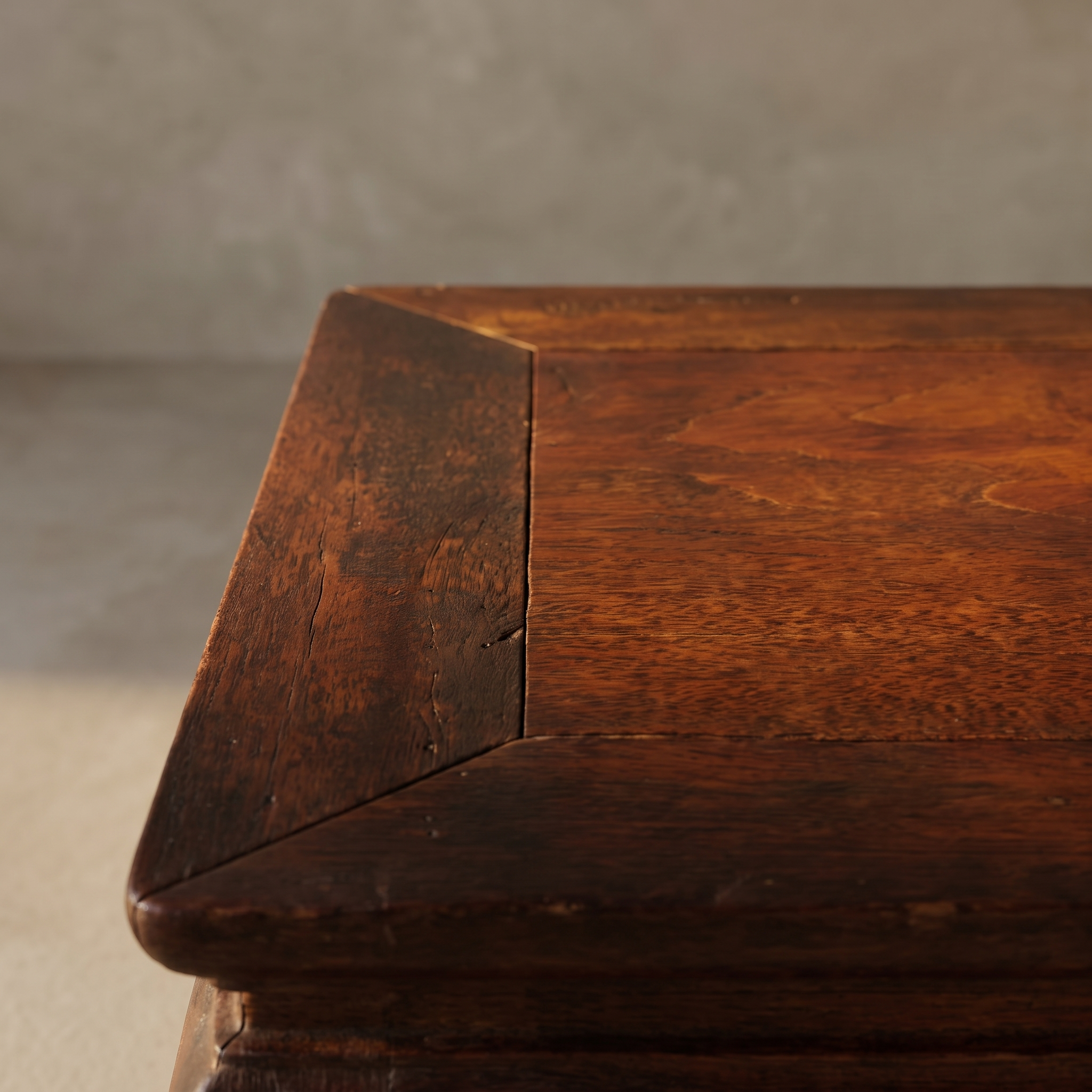 Close-up of the kang table's mitered top corner and wood grain