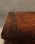 Close-up of the kang table's mitered top corner and wood grain