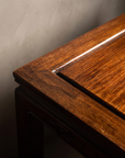 Macro detail of the tabletop wood grain and molded frame corner