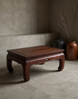Large vintage elmwood kang table, lifestyle view in a greige plaster room