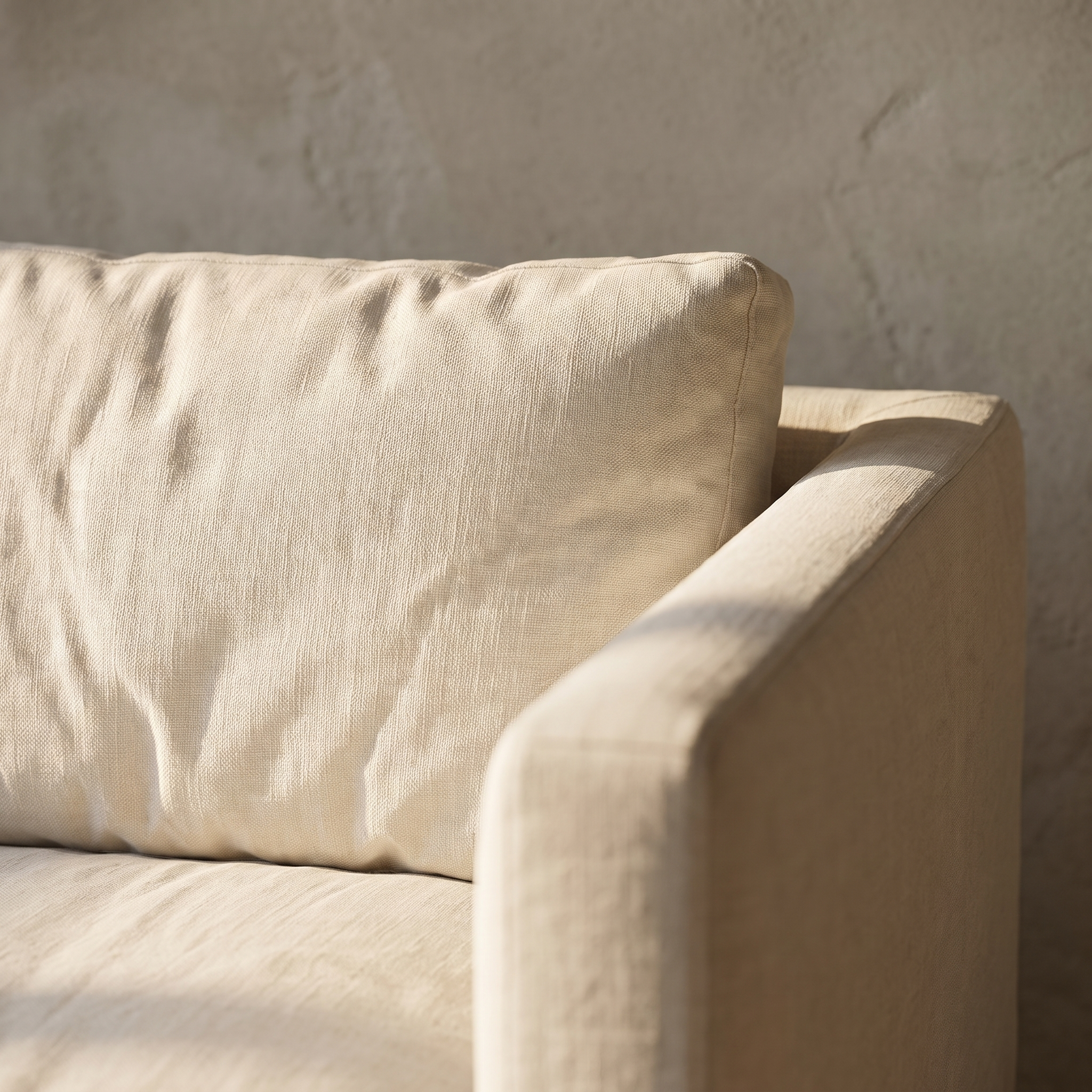 Detail of the linen weave and square track arm of the sofa