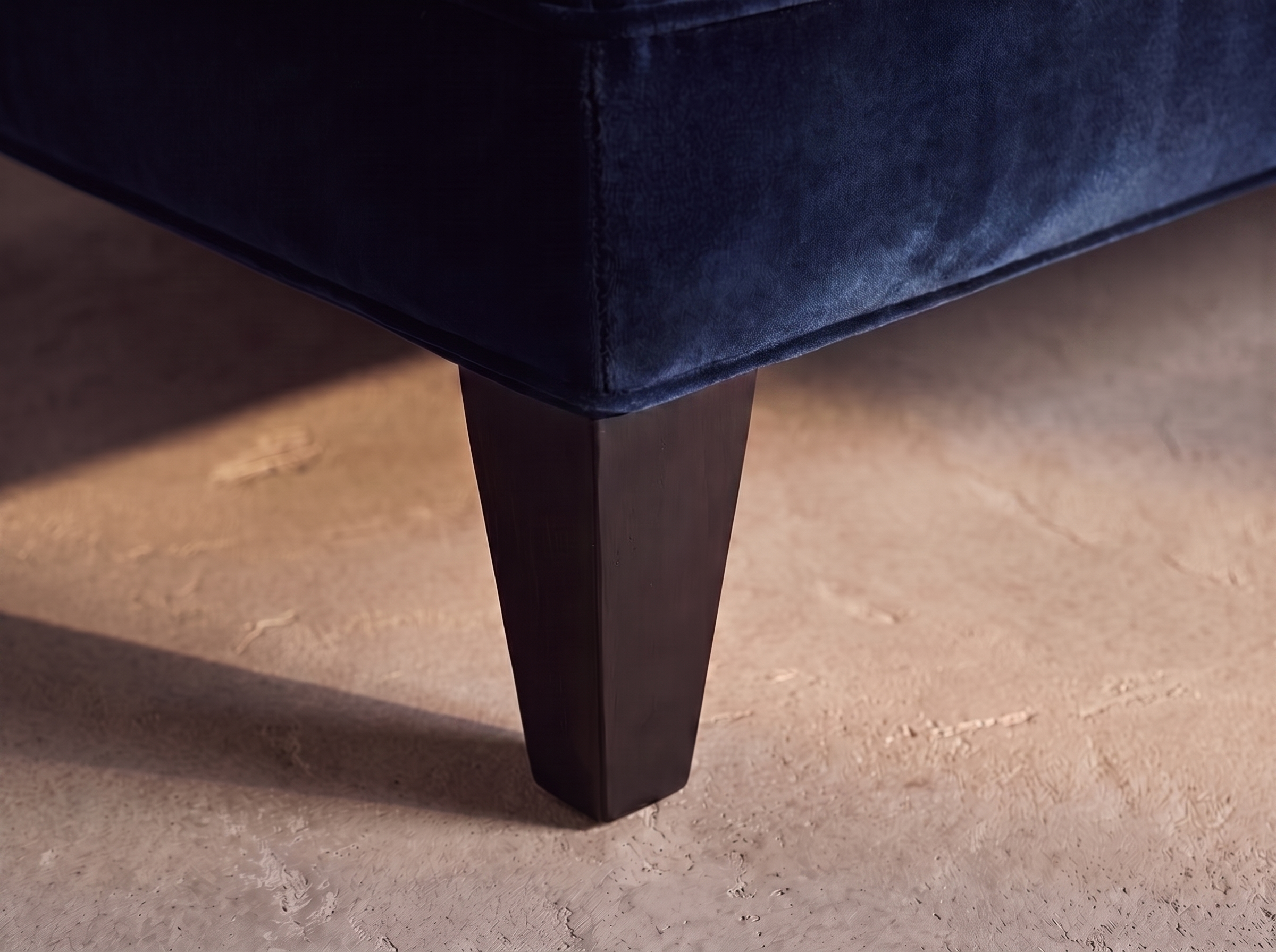 Shenandoah navy velvet sofa, tapered espresso leg detail
