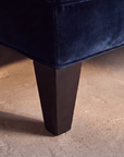 Shenandoah navy velvet sofa, tapered espresso leg detail