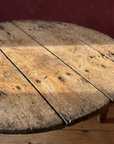 Antique round coffee table, darker, material macro detail