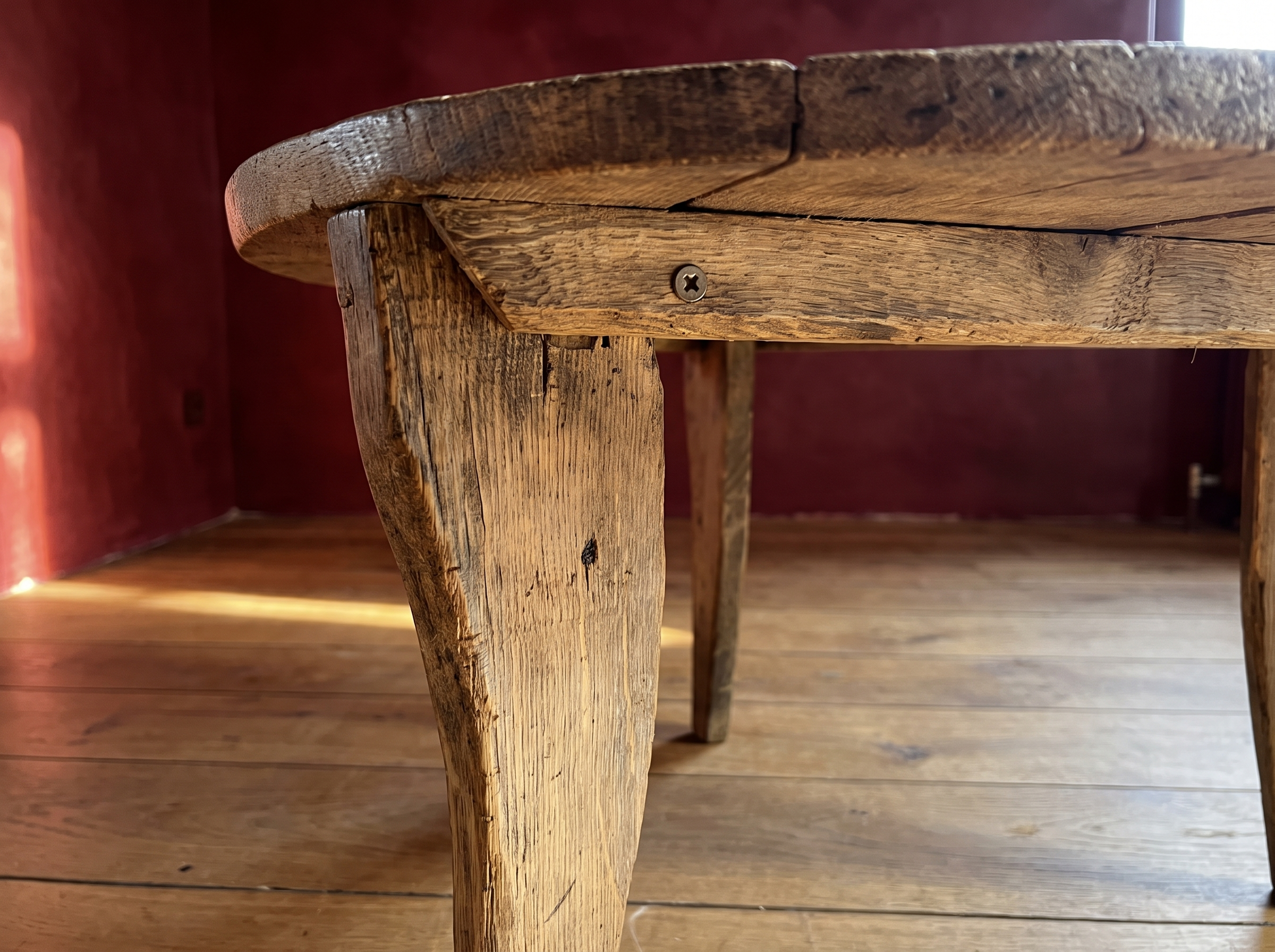 Antique round coffee table, darker, leg and corner brace detail