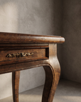 The Cabriole Writing Desk, macro detail of the side drawer corner and brass pull
