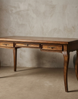 The Cabriole Writing Desk, three-quarter view showing the cabriole legs and three-drawer front