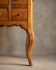 Apothecary six-drawer side table, leg and apron detail