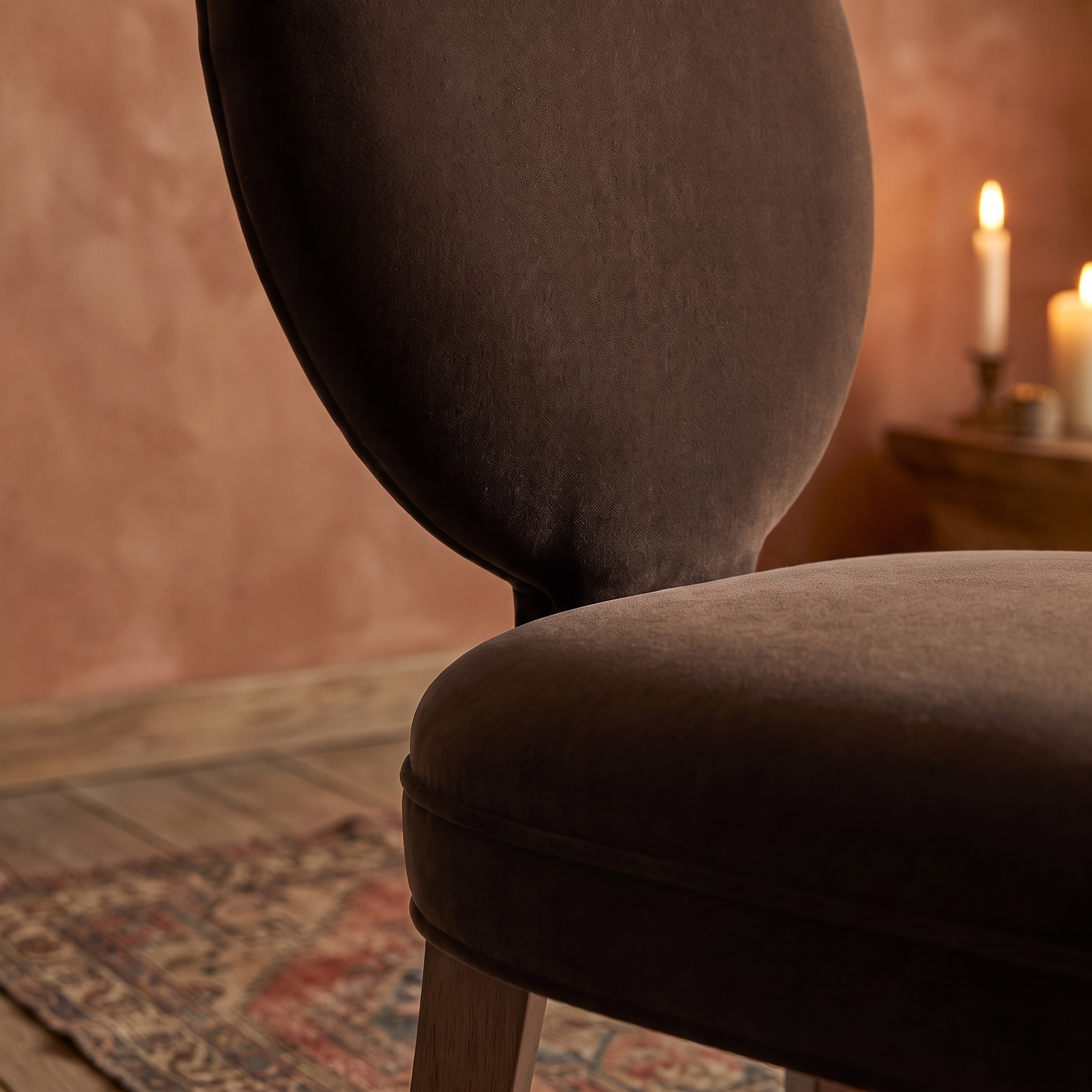Detail of the oval velvet back and seat junction, warm domestic room