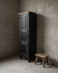 Little Pantry Armoire, 45 degree three-quarter view showing the three panel door and narrow form