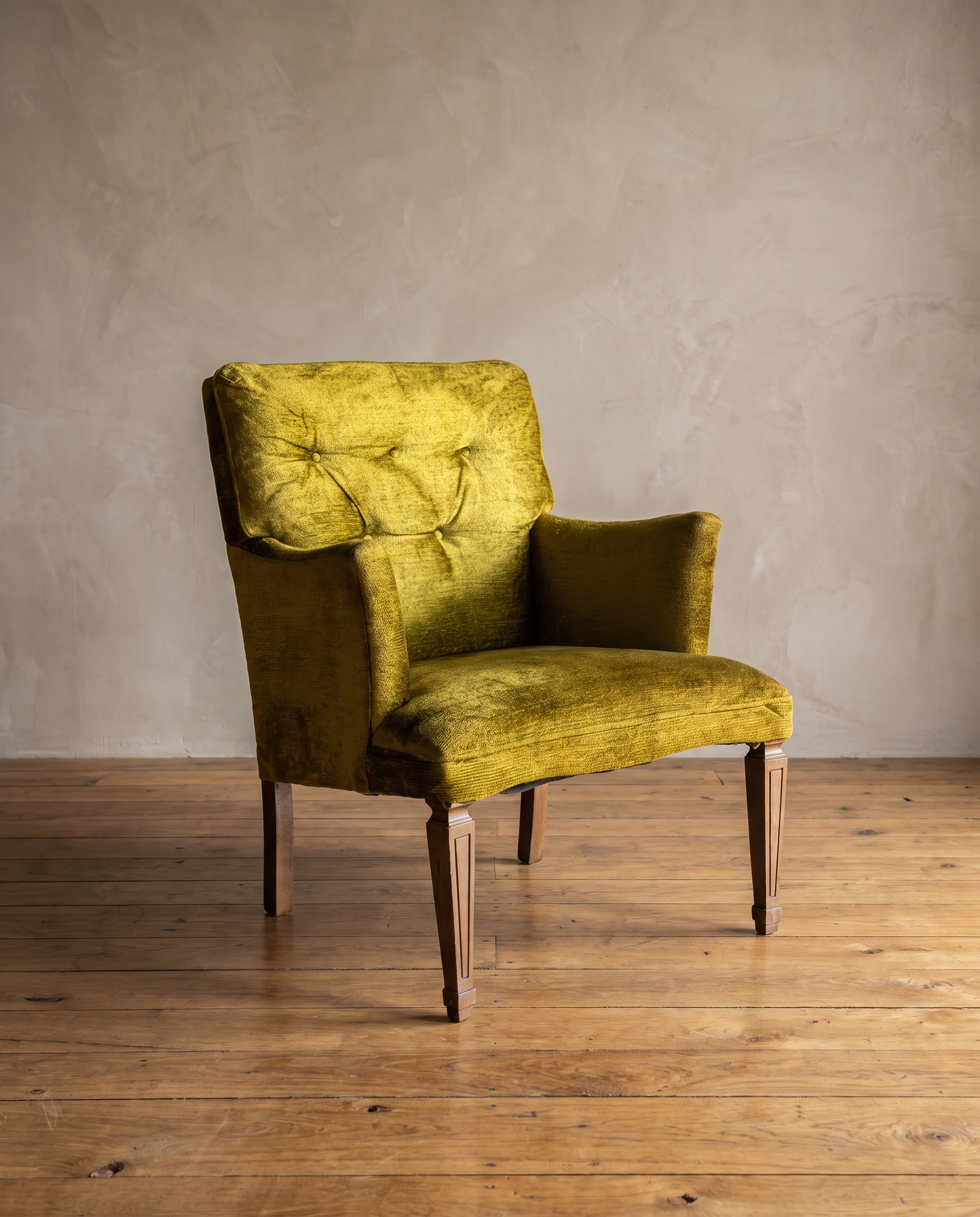 Chartreuse velvet diamond-tufted vintage armchair, clean three-quarter product view