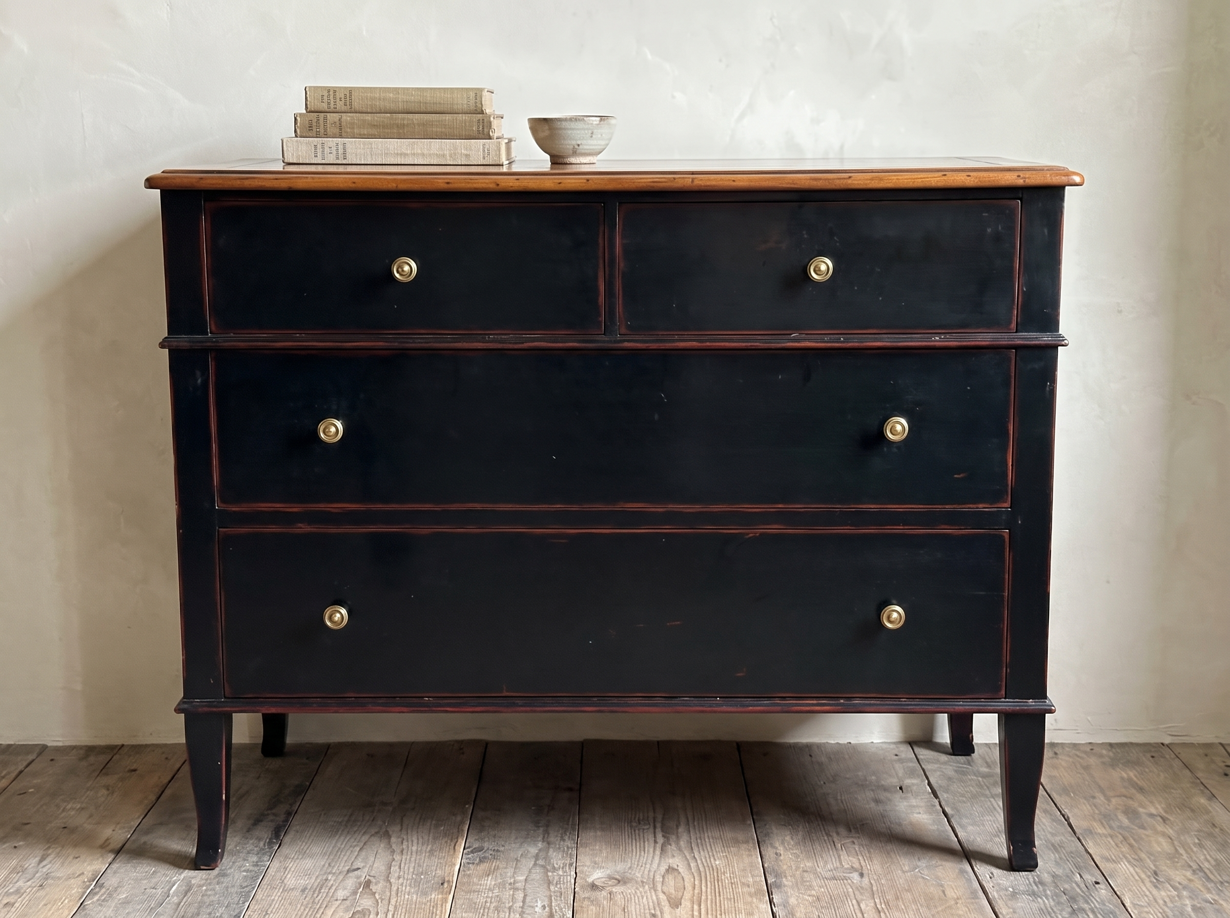 Atelier de Madeleine chest styled lightly with a stack of books and a small ceramic bowl