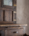 Detail of textured glass door, brass hinges and worn countertop on the Antique Hoosier Bakers Cabinet