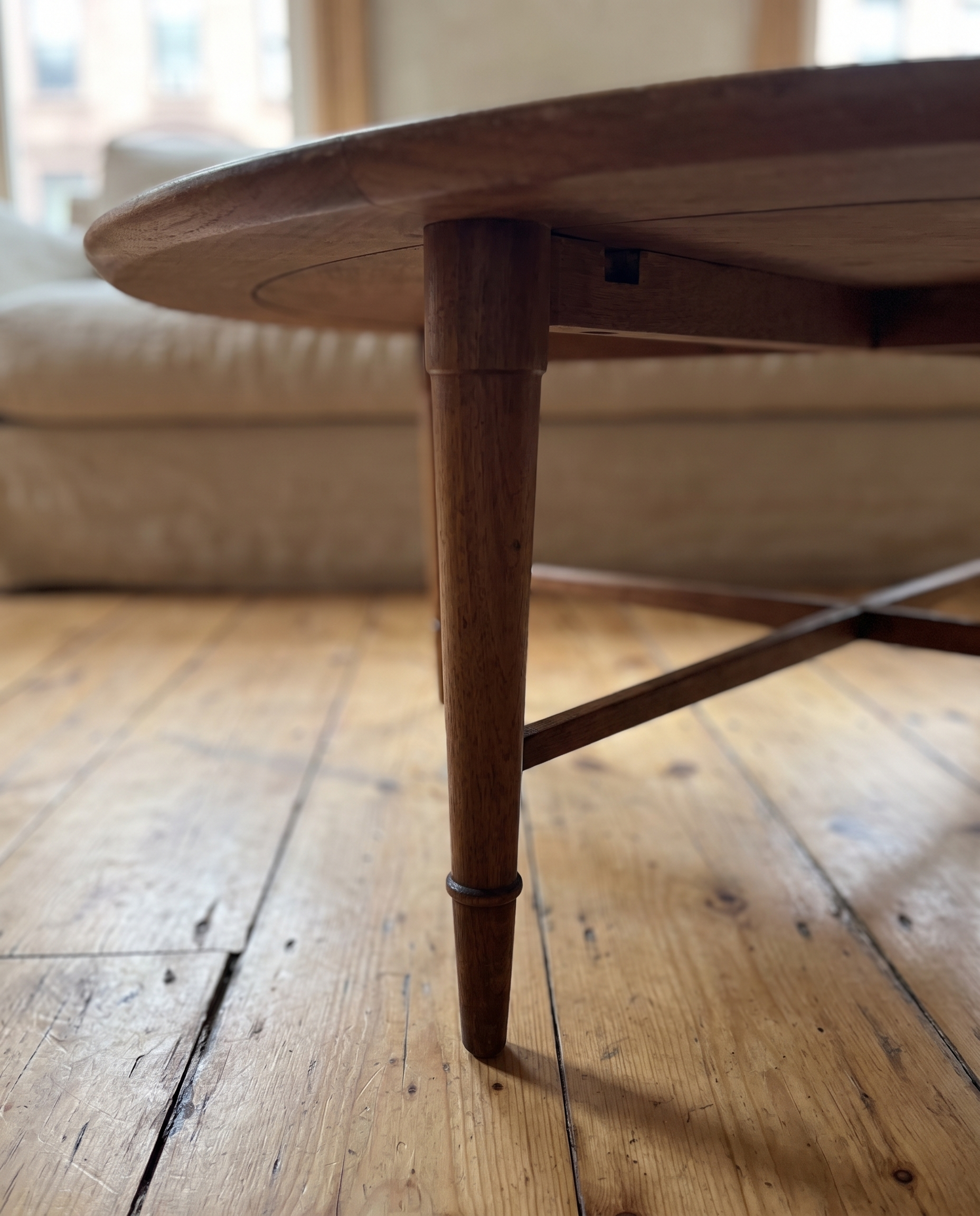 Detail of a tapered walnut leg with ring collar and the X stretcher joint