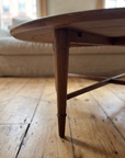 Detail of a tapered walnut leg with ring collar and the X stretcher joint