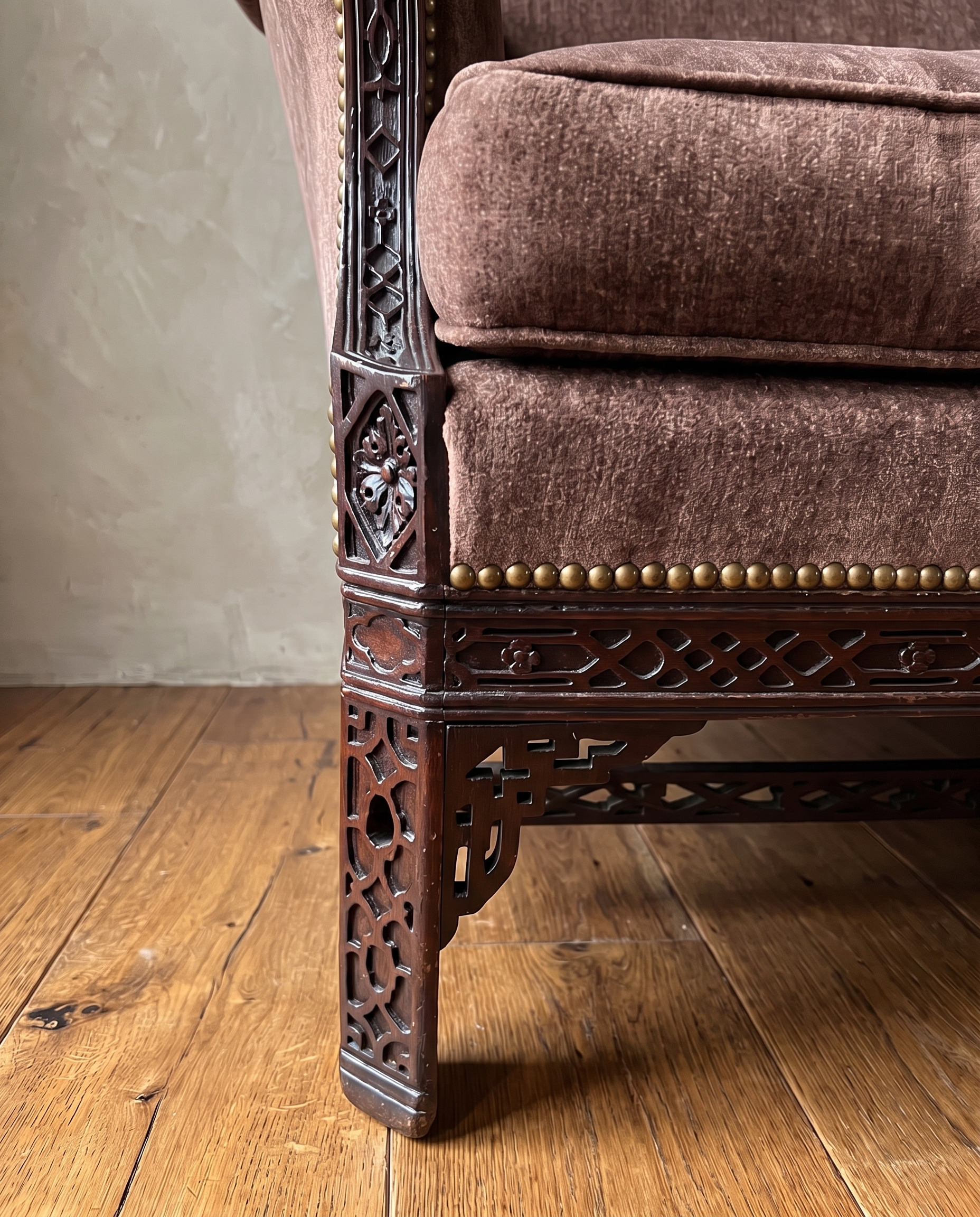 Detail of carved rosette corner block, pierced fretwork leg and brass nailheads