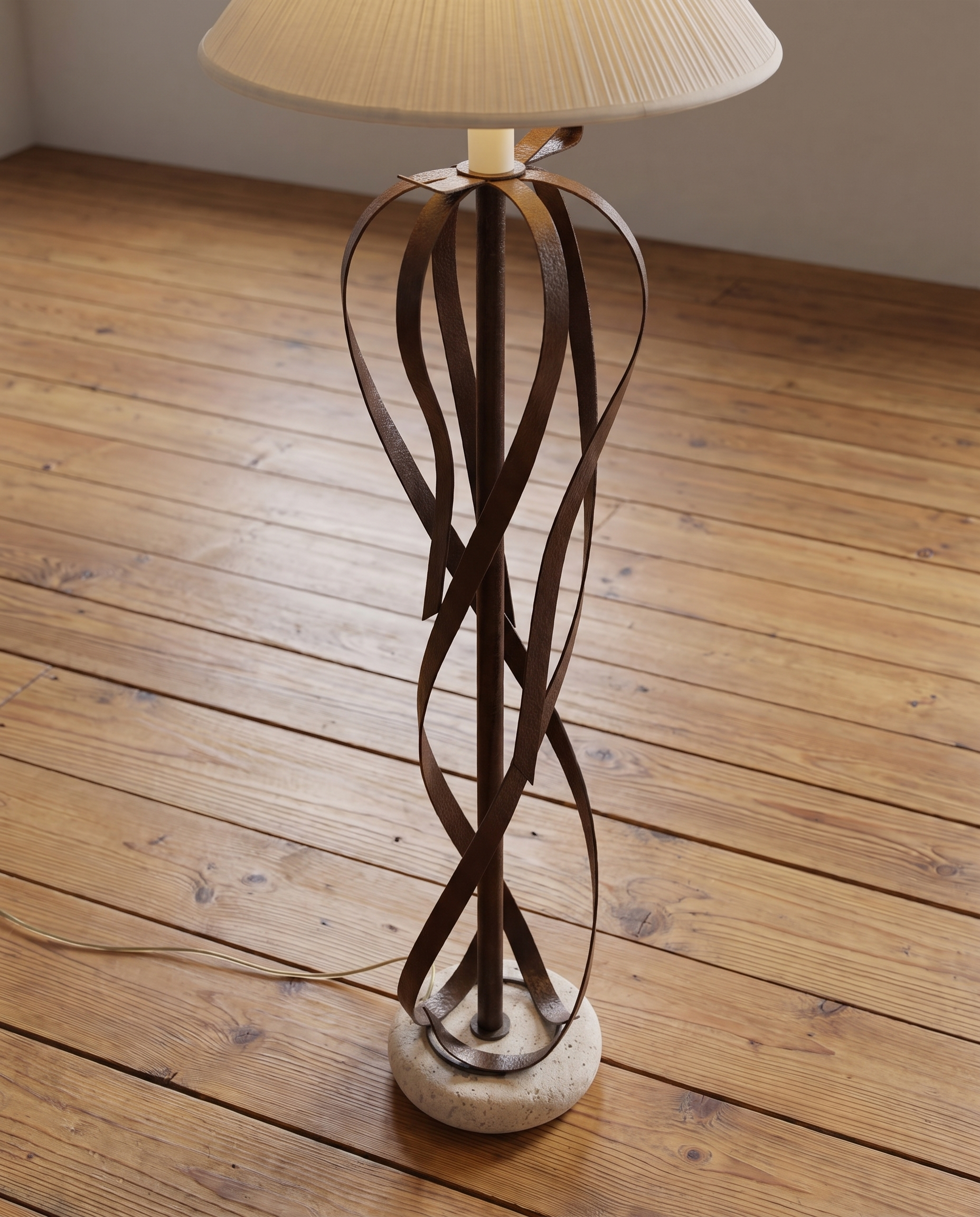 Lower lamp and rounded travertine base on a reclaimed wood floor