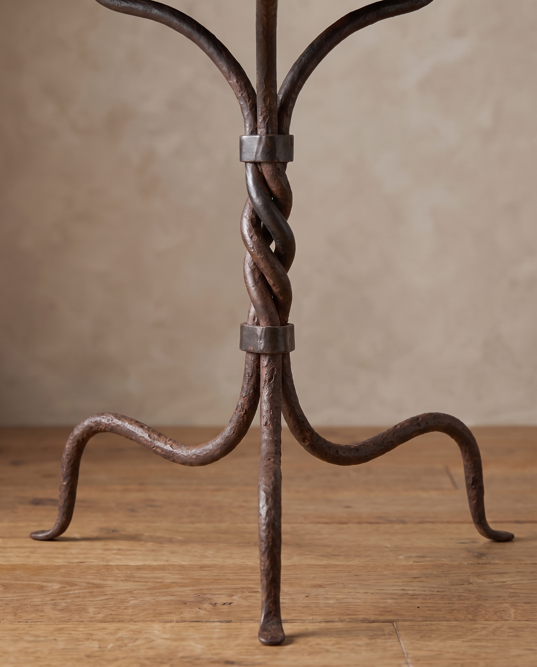 Detail of the rope-twisted wrought iron column with hammered collar bands