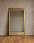 Front view of the gilt reeded mirror with beveled glass