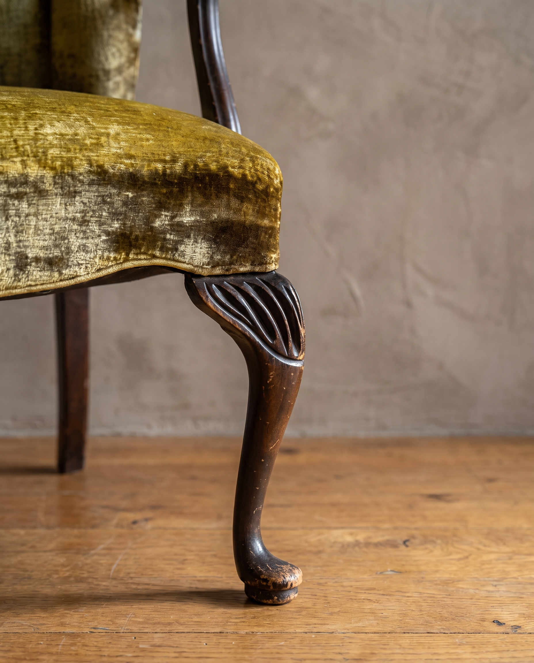 Detail of the fluted shell-carved cabriole front leg and pad foot