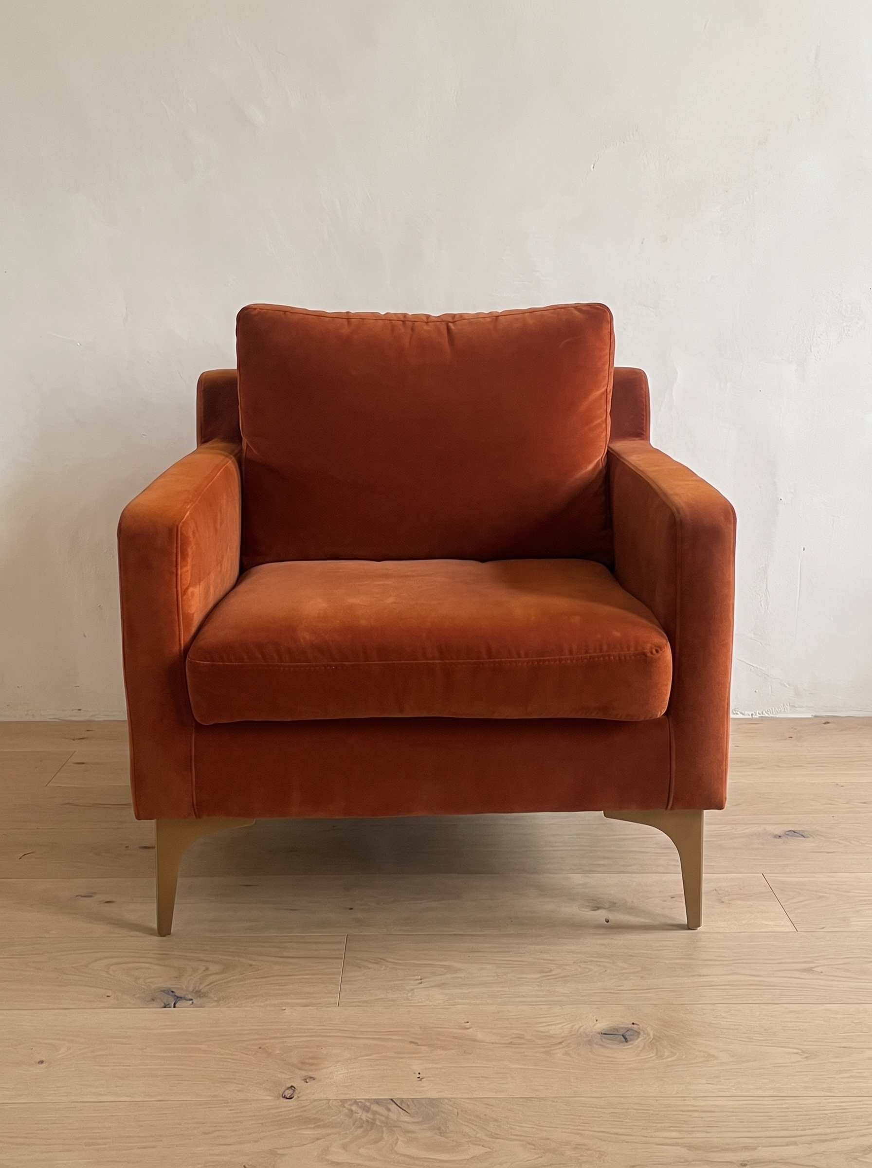 Rust velvet armchair, front view