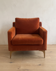 Rust velvet armchair, front view