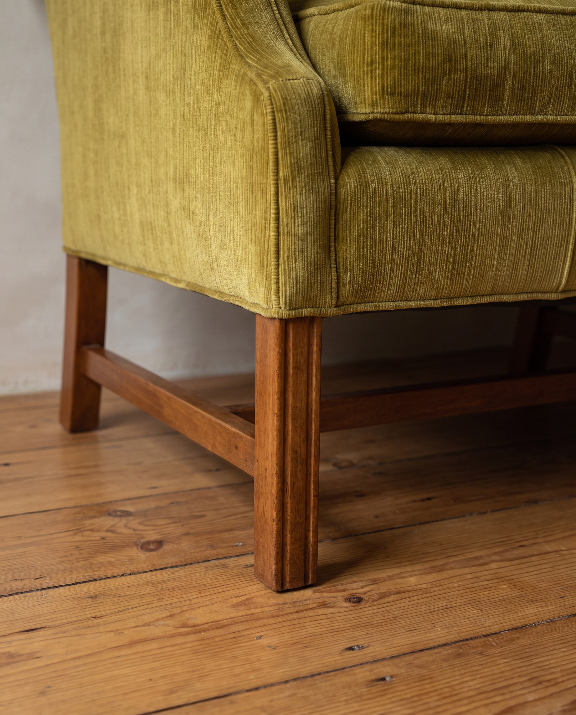 Detail of the straight mahogany leg and stretcher