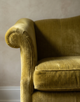 Detail of the rolled scroll arm and ribbed strie velvet