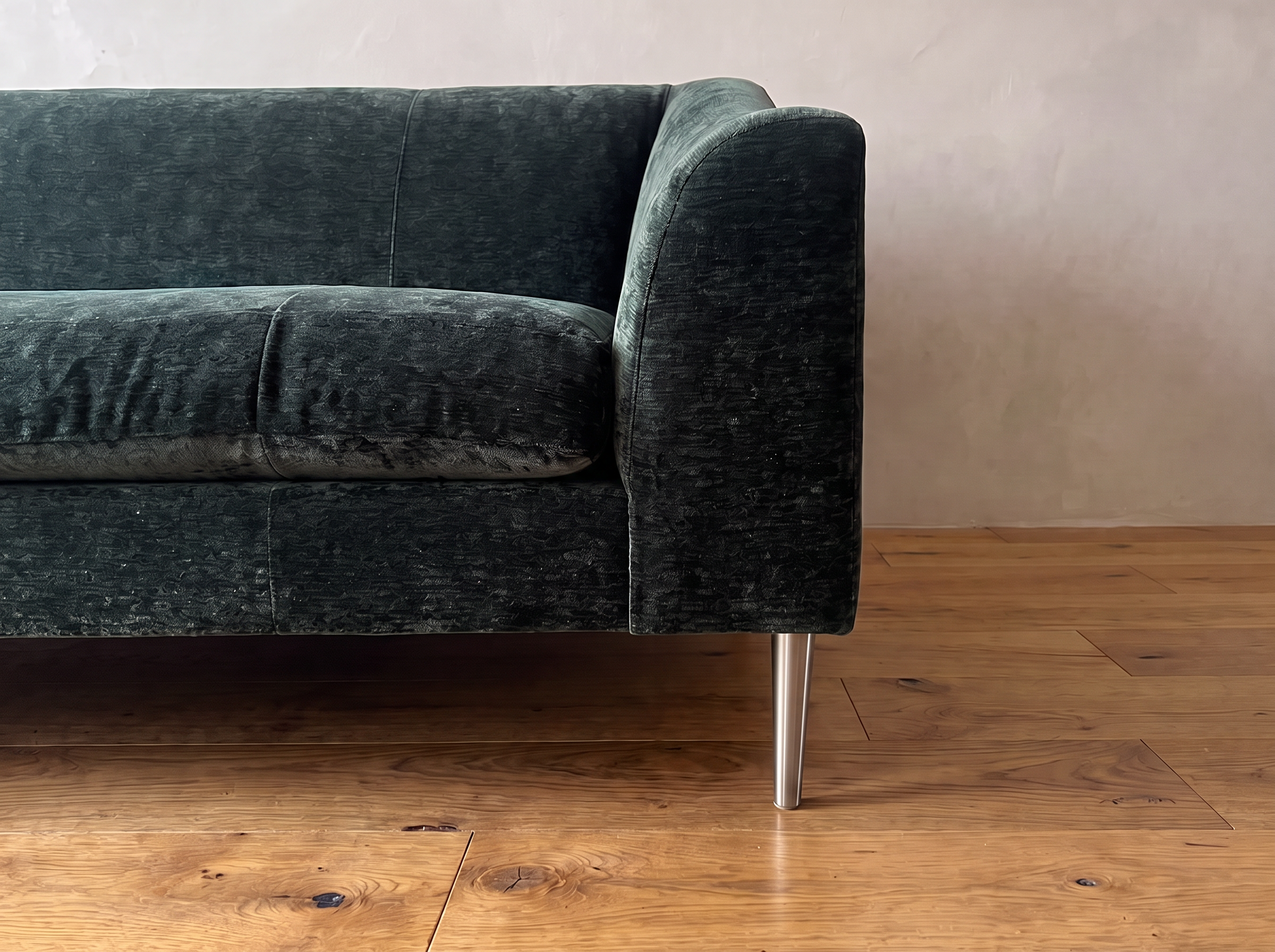 Detail of the right arm and brushed nickel leg