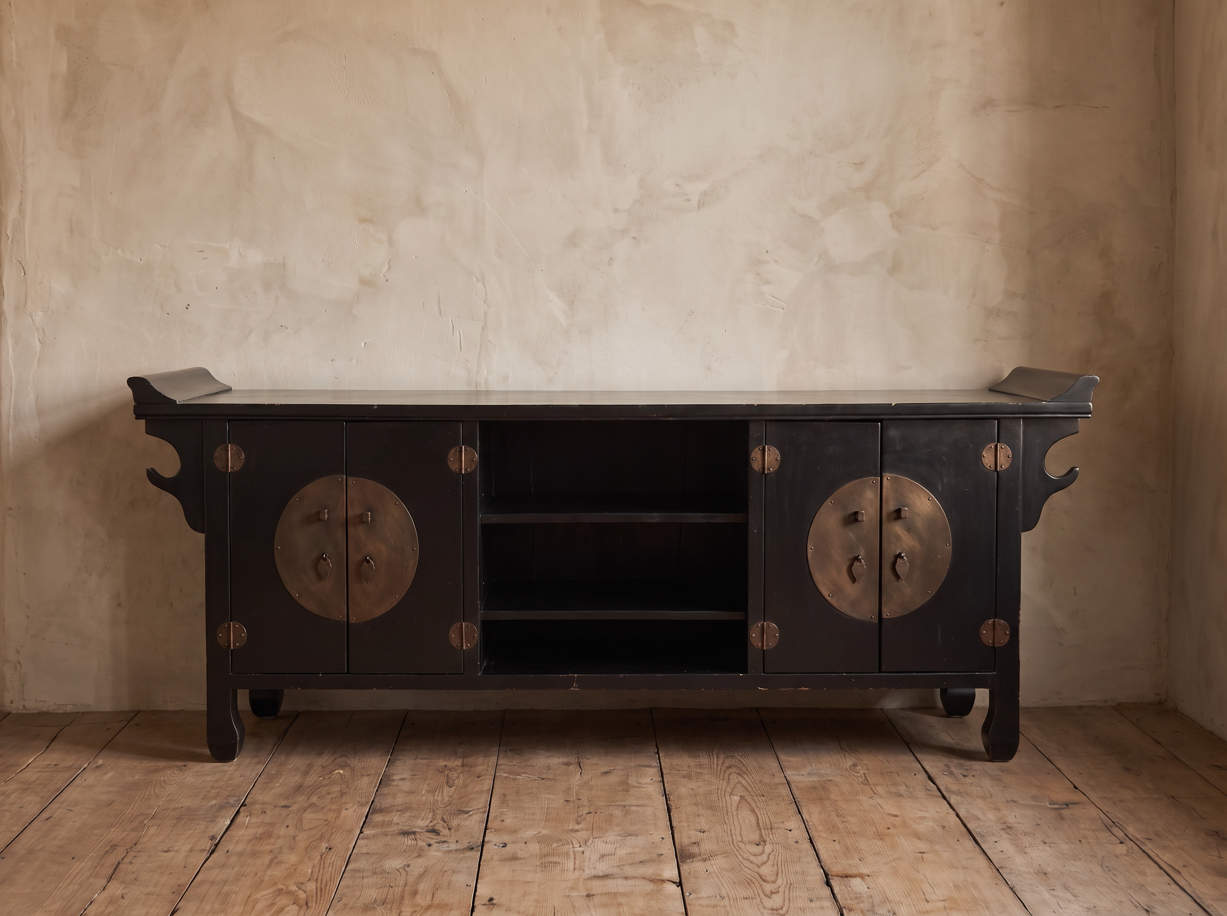 Front view of the black lacquer Chinese TV console showing two cabinets and open center shelves