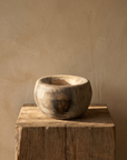 Antique stone mortar on an oak block