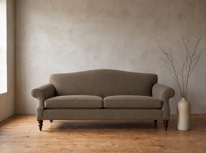 The Marcel camelback sofa in mushroom grey-brown, front view
