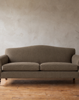 The Marcel camelback sofa in mushroom grey-brown, front view