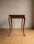 Side profile of the oak writing desk showing the S-curve of the cabriole legs