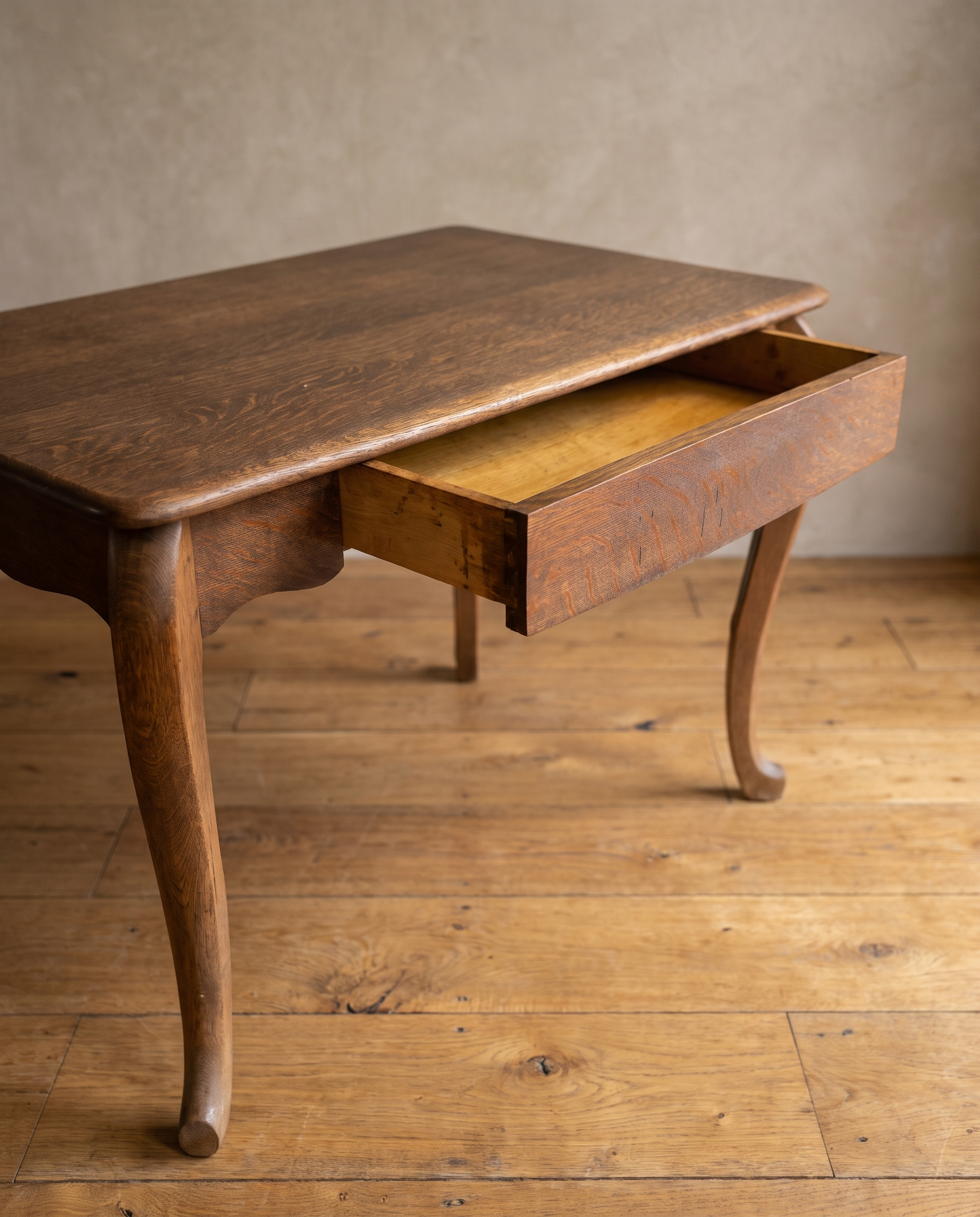 The desk's single wide drawer pulled open