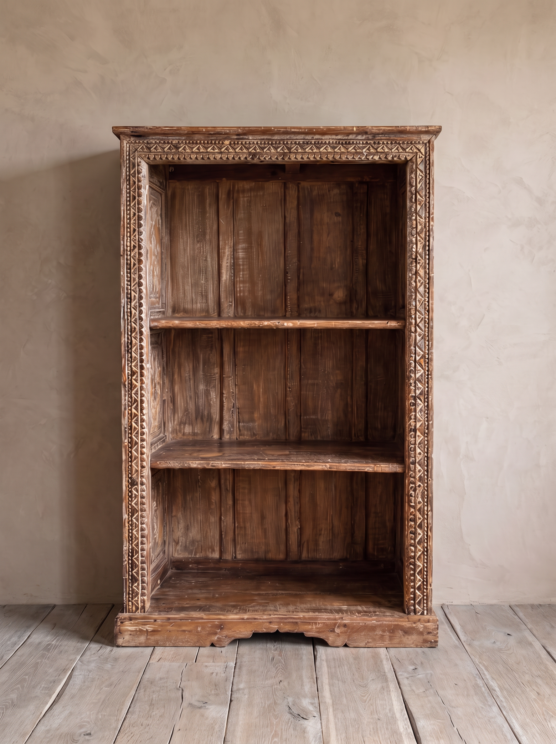 Carved Patina Bookcase from the front, showing the carved border and three open compartments.