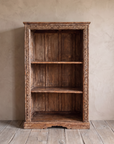 Carved Patina Bookcase from the front, showing the carved border and three open compartments.