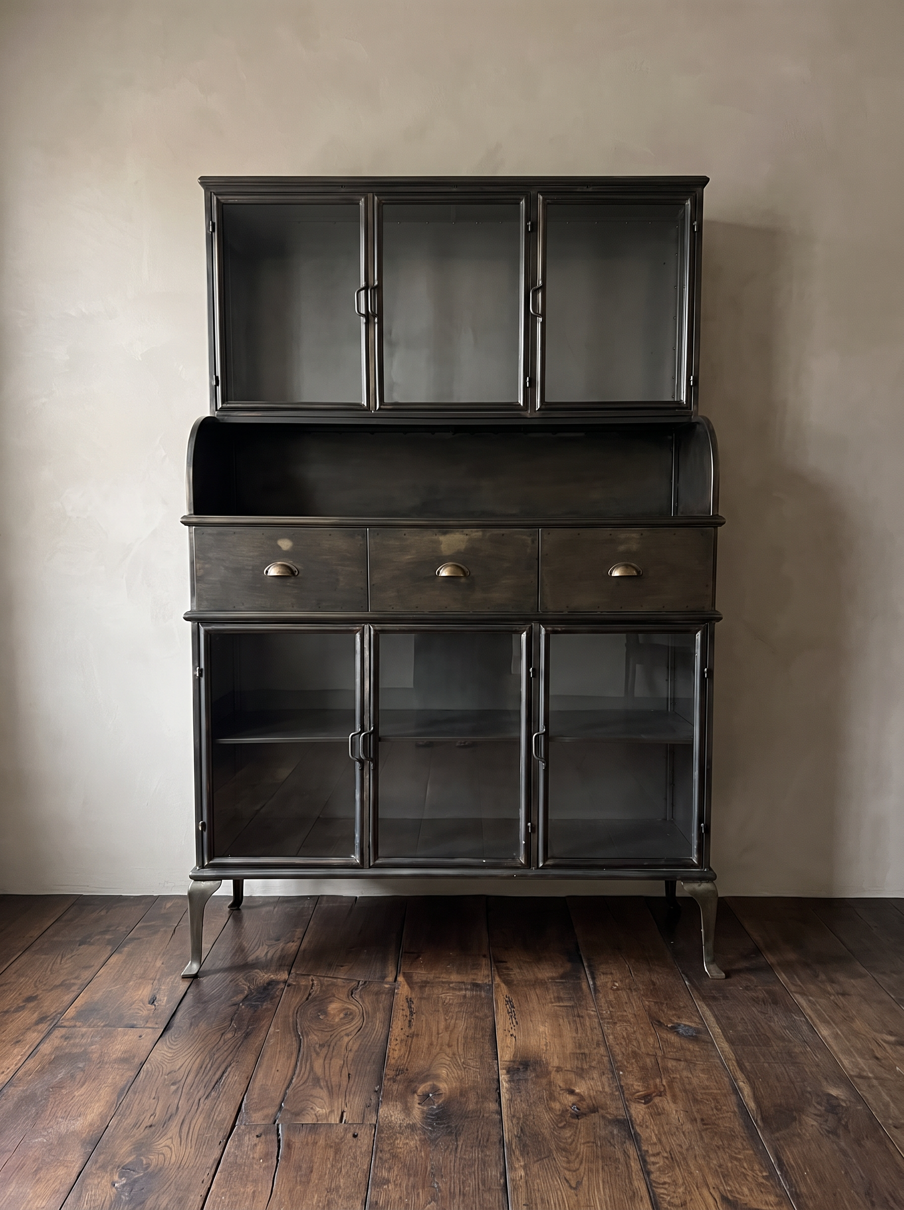 Apothecary steel hutch straight-on: three glass doors above, three drawers, three glass doors below, cabriole legs