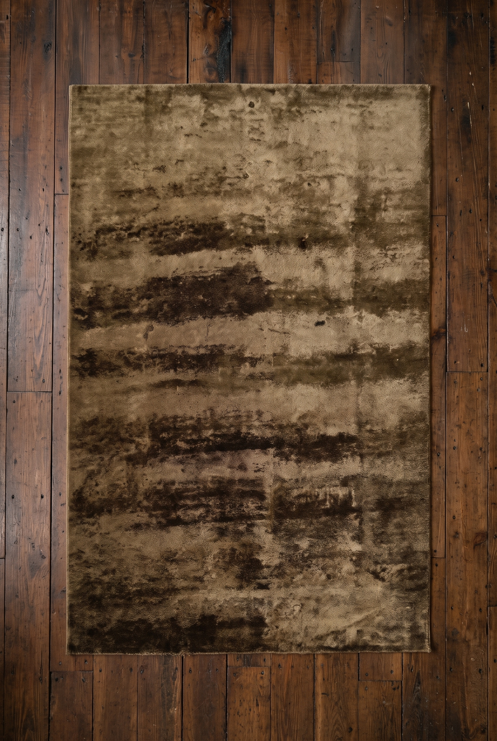 Overhead view of the full 5x8 olive and brown abstract Ralph Lauren rug on wide plank floor