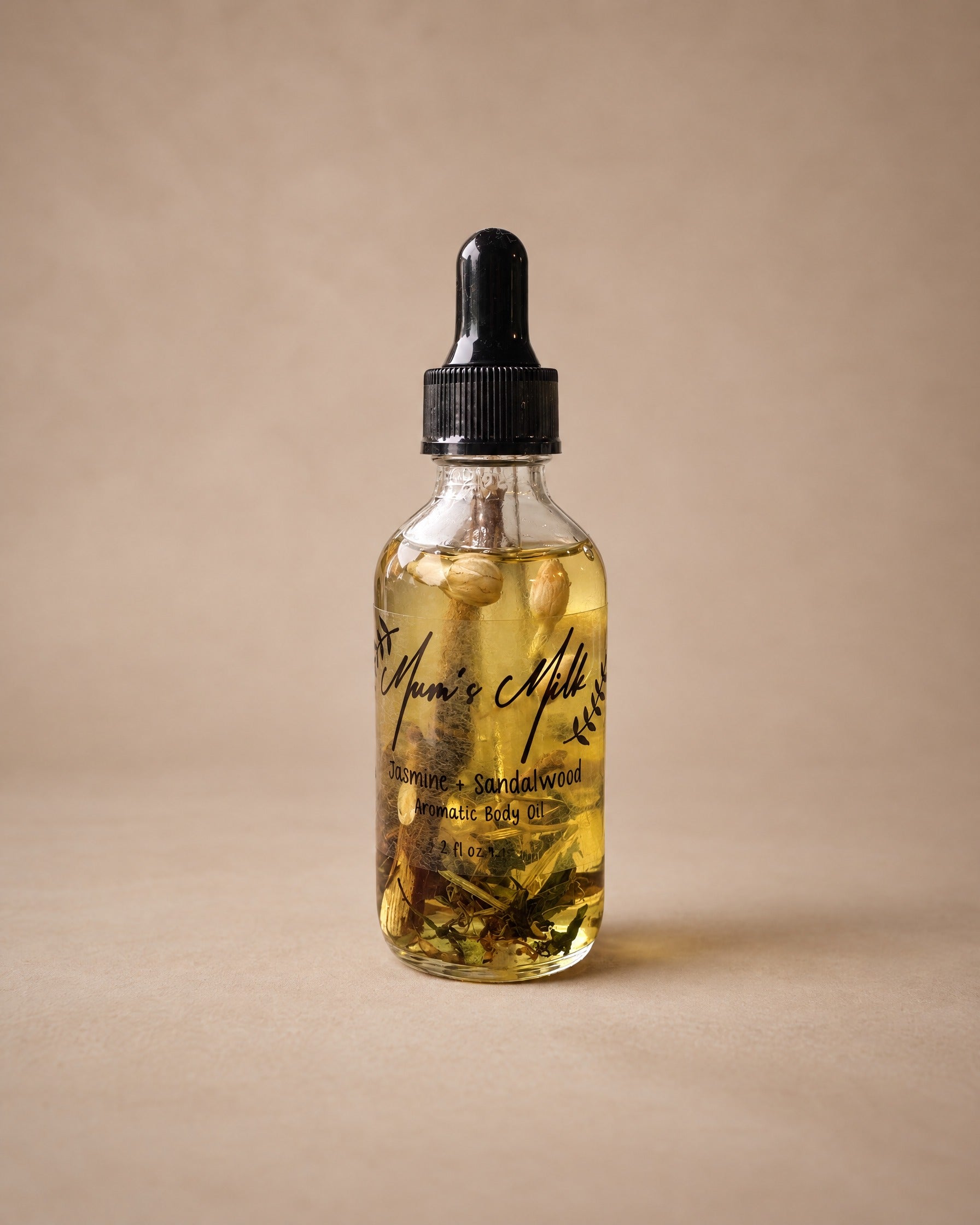 Jasmine + Sandalwood Aromatic Body Oil by Mum's Milk, glass dropper bottle with jasmine buds and sandalwood