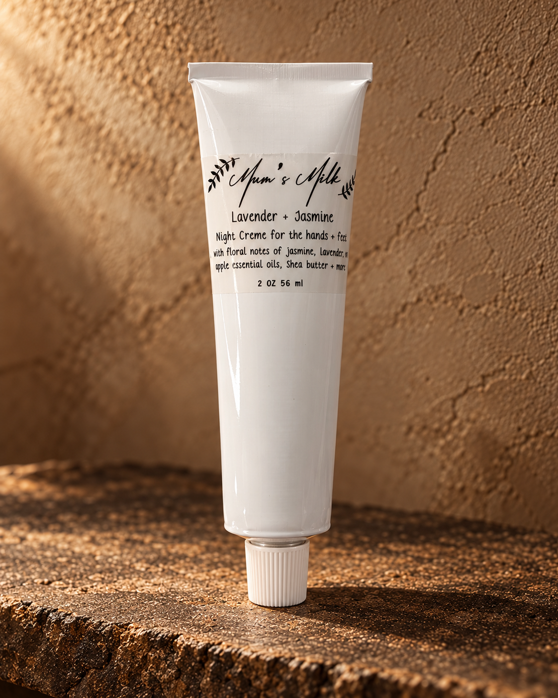 Mum's Milk Lavender and Jasmine Night Creme 2 oz tube on weathered stone