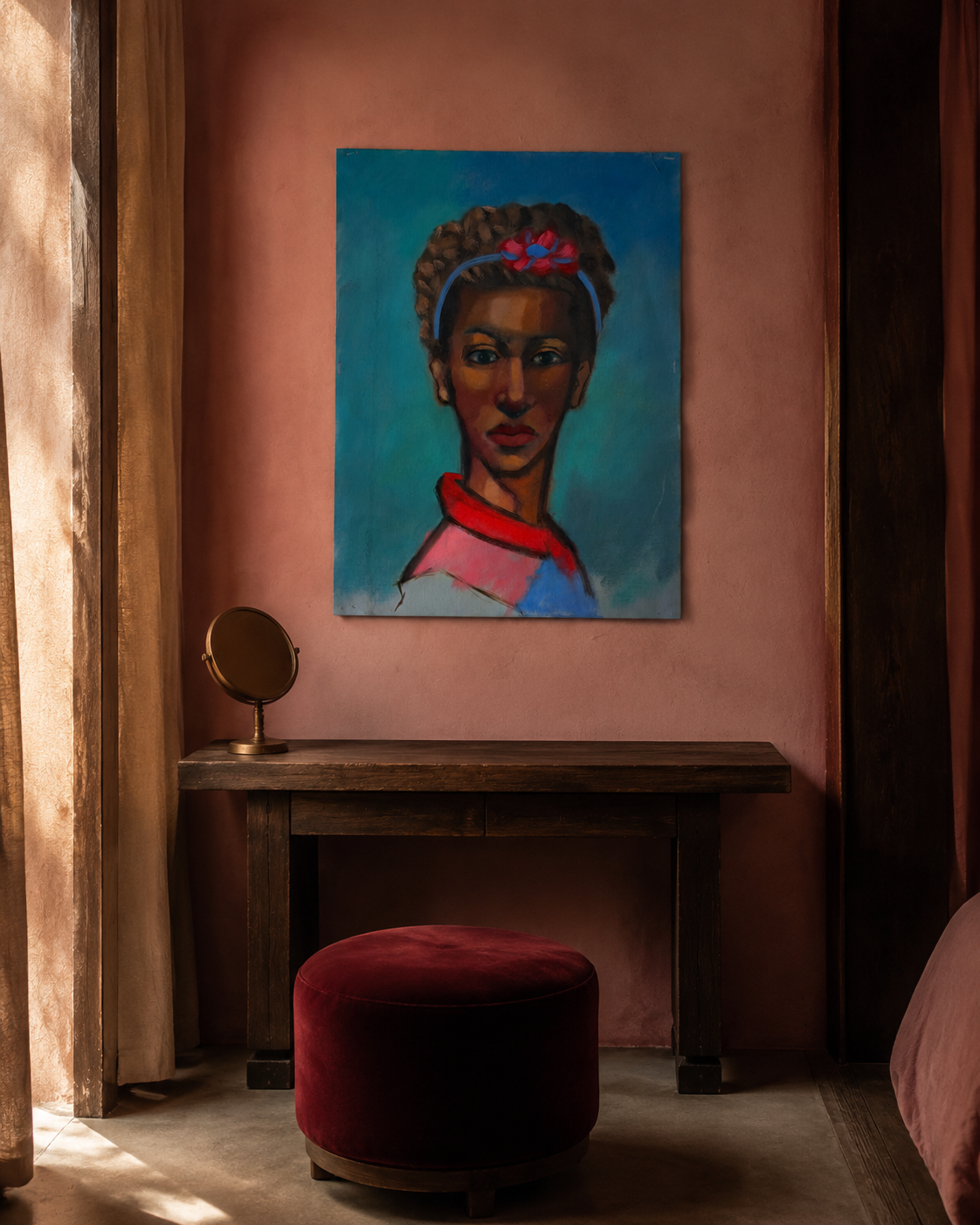 Portrait of a woman with a crown of braids on a blue ground, hung above a dark console in a pink plaster bedroom