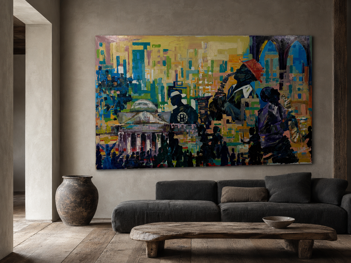 Wide panoramic street scene with church and trumpet player hung above a dark sofa in a warm plaster room
