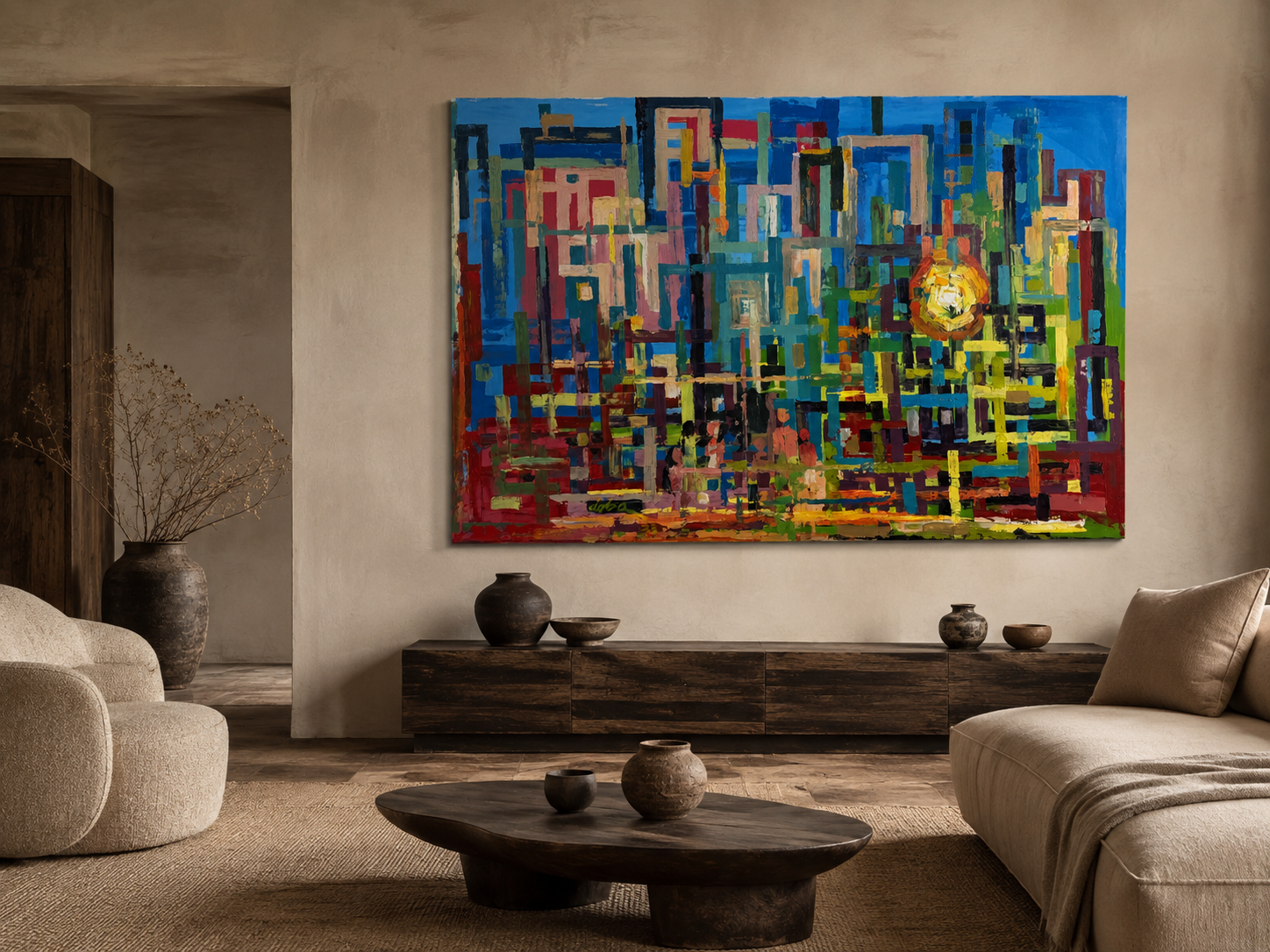 Blue and red abstract cityscape with a rising sun hung above a low sideboard in a warm plaster living room